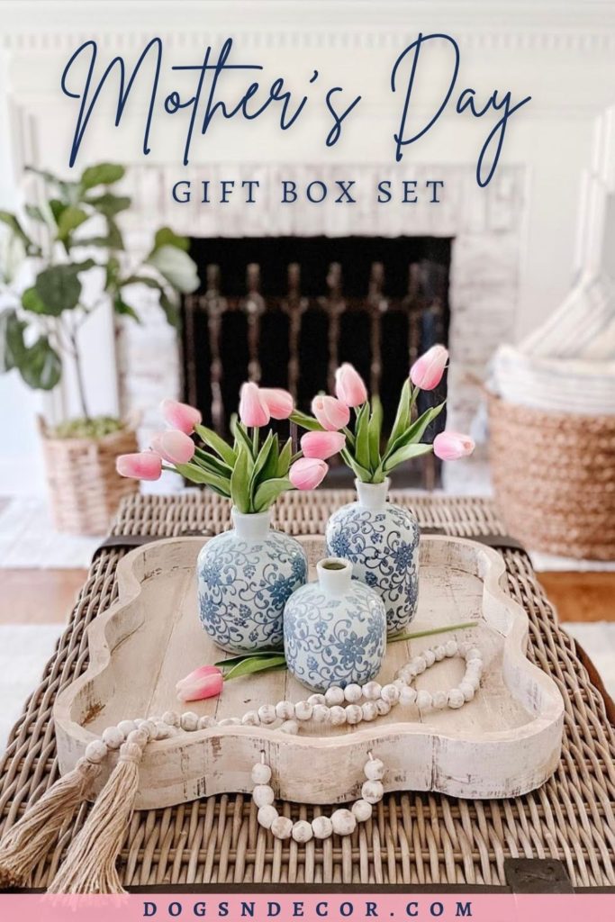 Table Decor blue and white 3 piece bud vases with pink tulips and a distressed table tray in front of beautiful white washed brick fireplace