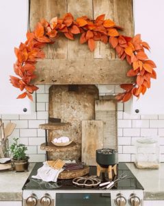 fall decor box displayed on beautiful farmhouse kitchen stove